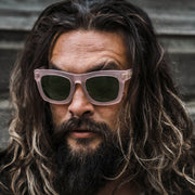 Jason Momoa wearing Crasher sunglasses pink frame vintage green lens